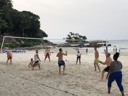 Team CN&CO playing volleyball on the beach at Club Med Bintan Island in Indonesia